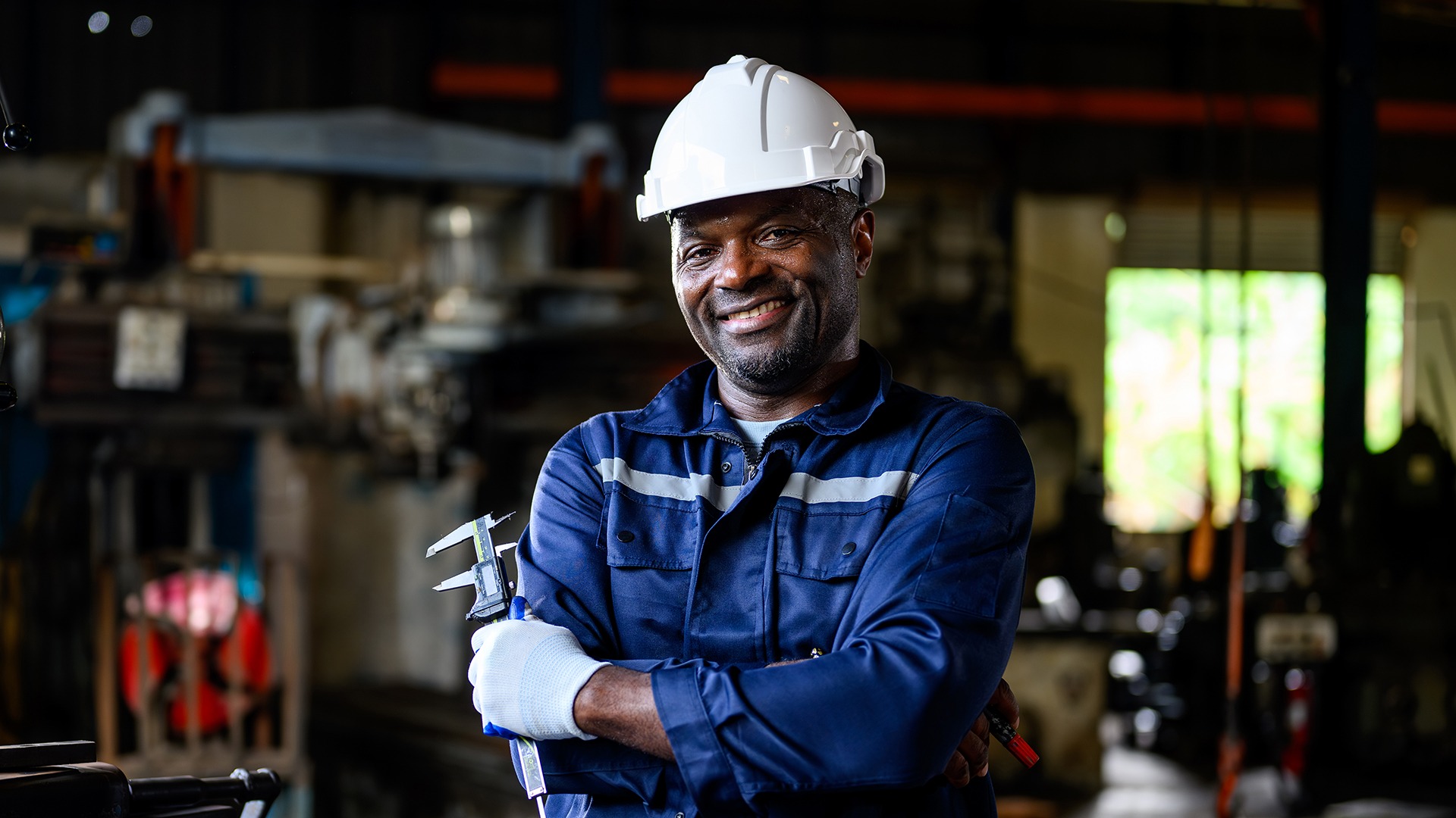 Concrete plant repair technician inspecting a mixer gearbox
